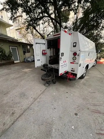 Magnet Plumbing service vehicle on-site for Grease Trap Cleaning in Biscayne Bay